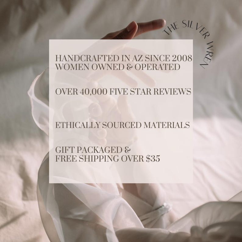 May include: A white text box with the words "THE SILVER WREN" at the top, followed by "HANDCRAFTED IN AZ SINCE 2008", "WOMEN OWNED & OPERATED", "OVER 40,000 FIVE STAR REVIEWS", "ETHICALLY SOURCED MATERIALS", "GIFT PACKAGED & FREE SHIPPING OVER $35".