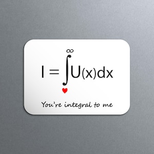 May include: White rectangular magnet featuring a mathematical equation and the phrase "You're integral to me." The equation includes an integral symbol, a function, and a red heart symbol. Black text on a white background.