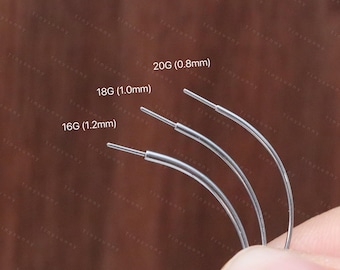 May include: Close-up of three silver-colored curved piercing needles. The gauges are labeled as 16G (1.2mm), 18G (1.0mm), and 20G (0.8mm). The needles are held against a brown background. The text "@Tinysunny Jewelry" is at the bottom.