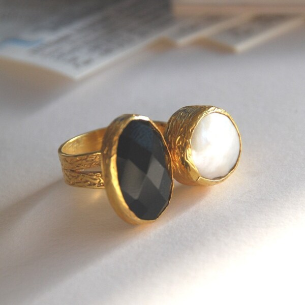 Gold Coated Silver Ring With A Faceted Oval Onyx Stone and a Pearl.