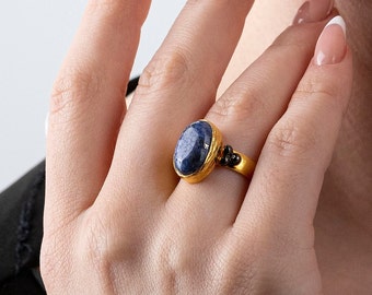 Lapis Lazuli Ring witha thick band, three silver balls on sides, with a blue oval Lapis Lazuli natural gemstone