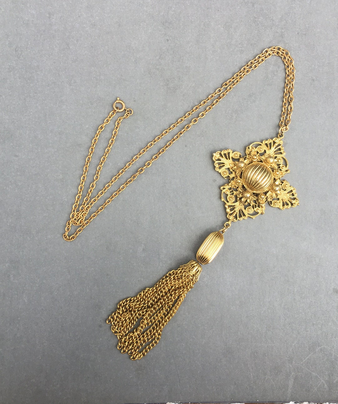 Tassel and Pendant Chain Motif on Mint Green Grid with Indigo and Maroon Highlights and Dotted Arcs main image 1