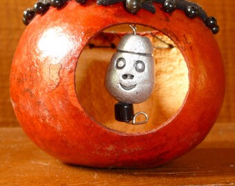 Charming tiny face in the red