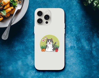 以下が含まれることがあります： 白い携帯電話ケースに、白いシャツとグレーのズボンを着た漫画の猫が描かれています。猫はハートと花に囲まれています。携帯電話ケースにはカメラレンズの切り抜きがあります。