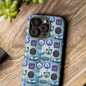 May include: A blue and grey phone case with a pattern of robot vacuum cleaners. The case has a camera lens cutout with three lenses.