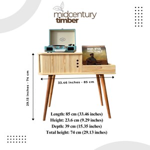May include: A light wood record player stand with a light blue record player on top. The stand has a shelf for records and is 33.46 inches wide and 29.13 inches tall.