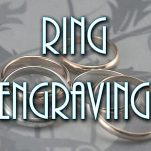 May include: Close-up of several gold and silver rings stacked on top of each other. The word "RING ENGRAVING" is written in white letters with a blue outline.