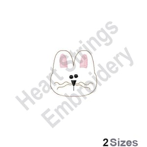 Puede incluir: Diseño de bordado de cara de conejo blanco con orejas rosas y ojos negros. El diseño es perfecto para agregar un toque lindo a cualquier proyecto.
