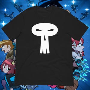 May include: Black t-shirt featuring a white skull design. The skull has an oval head with angry eyes and a vertical line for the nose, with three lines for the teeth. The background has cartoon characters and stars.