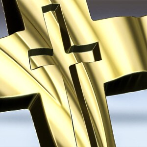 May include: A gold-colored metal cross with a three-dimensional design. The cross is made of a smooth, shiny metal and has a slightly curved shape.