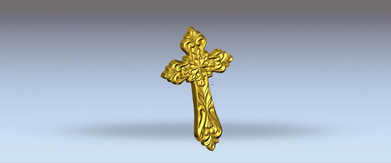 May include: A gold-coloured cross featuring elaborate floral and scrollwork. The cross has a gently curved shape and is set against a soft, gradient background. The detailed design suggests a religious or decorative item.