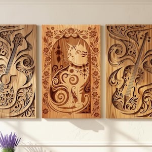 May include: Three wooden wall art panels. The panels feature intricate laser-cut designs of a guitar, a cat, and a violin. The cat panel is centered, framed by floral patterns. The guitar and violin panels have swirling, decorative elements.