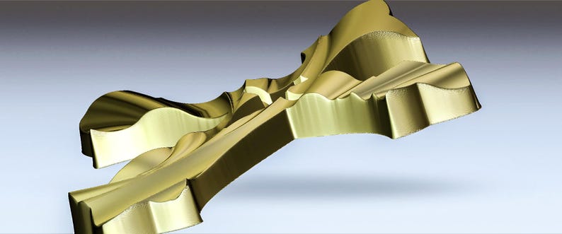 May include: A gold-colored metal sculpture with a unique, abstract design. The sculpture is made of multiple pieces that are joined together to create a complex and intricate shape.