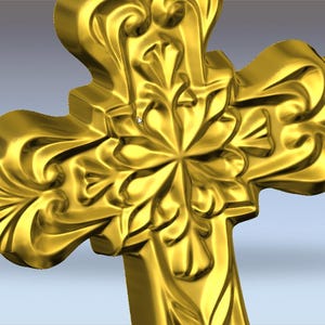 May include: A gold-coloured cross featuring elaborate floral and scrollwork. The cross has a three-dimensional design with a central flower-like motif and curved edges, set against a gradient background.