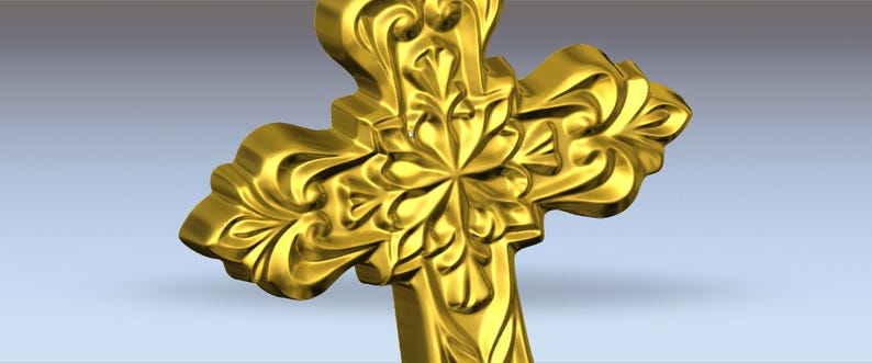 May include: A gold-coloured cross featuring elaborate floral and scrollwork. The cross has a three-dimensional design with a central flower-like motif and curved edges, set against a gradient background.