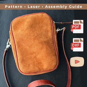 Könnte beinhalten: Rechteckige, orangefarbene Wildleder-Umhängetasche mit roter Paspel und langem, dünnem Riemen. Die Tasche hat silberfarbene Hardware und der Text "Pattern • Laser • Assembly Guide" steht oben. PDF- und DXF-Symbole sind ebenfalls sichtbar.