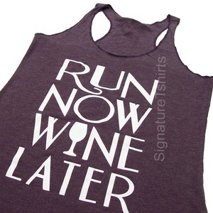 May include: A purple tank top with the text "Run Now Wine Later" printed in white. The text is stacked vertically with a wine glass icon between "Wine" and "Later".