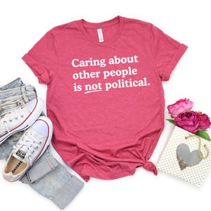 Caring about people is not political, Protest Shirt, Social Worker Shirt, Human Rights Shirt, Teacher Gift, Political Activism Shirts Heather Raspberry