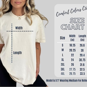 May include: Cream-coloured t-shirt with a size chart. The chart lists sizes S to 4XL, with width measurements from 46.35 to 75.57 cm and lengths from 67.56 to 85.09 cm. The text "Comfort Colors C1717" is at the top.