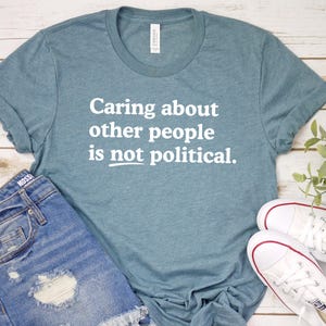 Caring about people is not political, Protest Shirt, Social Worker Shirt, Human Rights Shirt, Teacher Gift, Political Activism Shirts Heather Slate/white