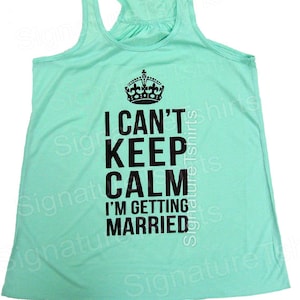 May include: A turquoise tank top with a black graphic that says "I can't keep calm I'm getting married" with a crown above the text.