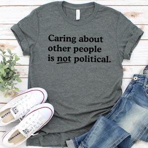Caring about people is not political, Protest Shirt, Social Worker Shirt, Human Rights Shirt, Teacher Gift, Political Activism Shirts Deep Heather/black