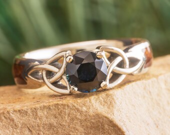 Wooden Celtic Engagement Ring with Trinity Knots and Dark Blue Sapphire