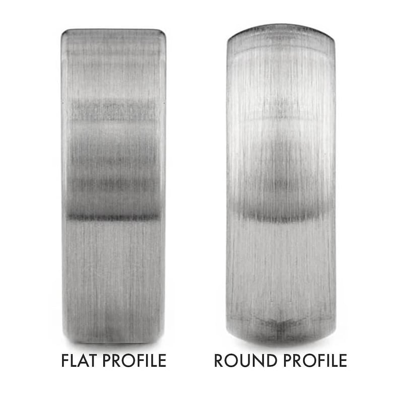 May include: Two metal rings, one with a flat profile and the other with a round profile. Both rings have a brushed finish.