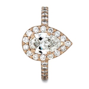 May include: A pear-shaped diamond engagement ring with a halo setting. The ring is set in rose gold and features a band of pave diamonds.