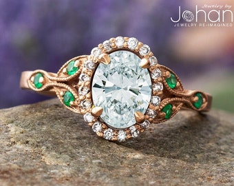Oval Halo Engagement Ring With Emerald Accent Stones