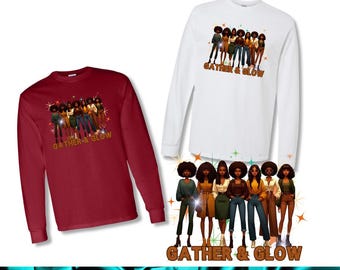 May include: Two long-sleeved shirts, one burgundy and one white, each displaying a graphic of eight women with afros. The text "GATHER & GLOW" is printed below the graphic in a brown, retro font. The women are wearing various outfits.