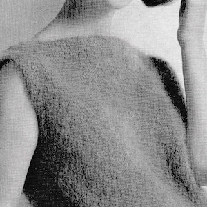 May include: A sleeveless knitted top with a scoop neck. The top is made of a soft, fuzzy yarn and has a relaxed fit.