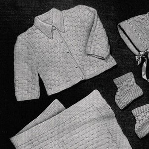 May include: A knitted baby set in a light gray color, including a cardigan, a bonnet, booties, and a blanket. The set features a simple, textured stitch pattern.