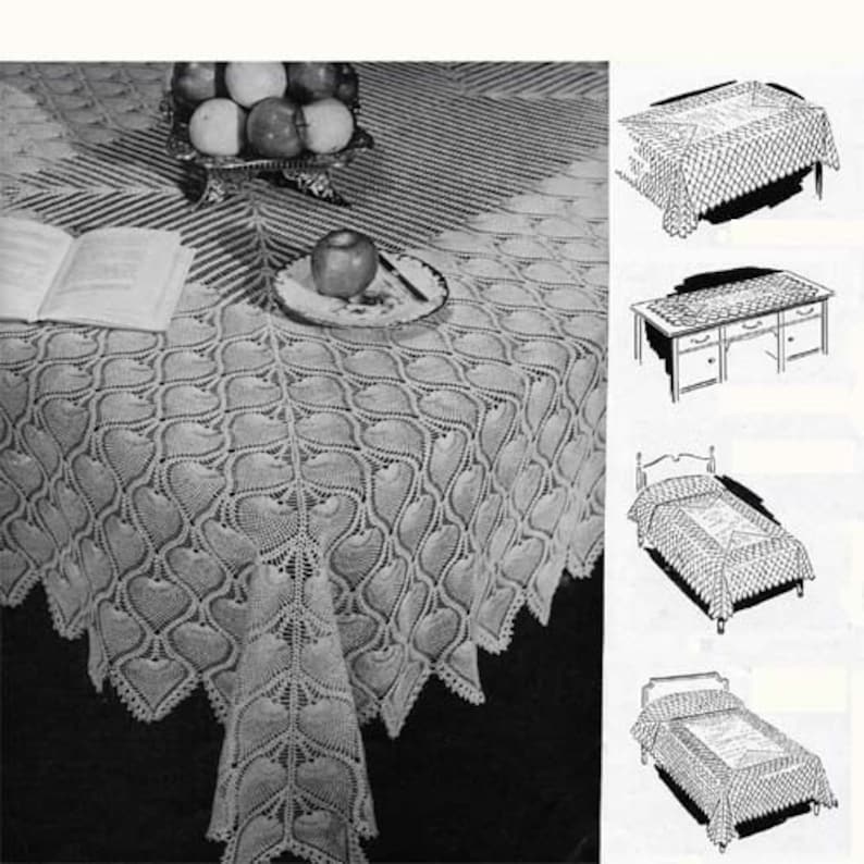 May include: A white crocheted tablecloth with a heart pattern. The tablecloth is laid on a table with a book and a bowl of apples. The image also shows three other examples of how the crochet pattern can be used: a bedspread, a table runner, and a smaller tablecloth.