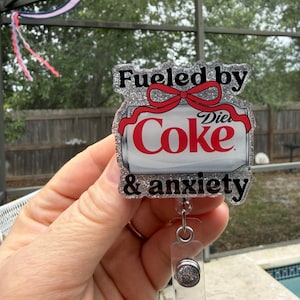Fueled by diet cola and anxiety. Glitter retractable badge reel. Funny adult humor.Teacher ID-student ID-RN-server badge-soda fan-medical