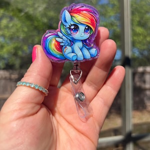 80s cartoon pony inspired glitter retractable badge reel. Health care badge-teacher/student ID-servers retail workers. Magnet option availab