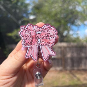 Coquette bow “very demure, very mindful, very cutesy” glitter retractable badge reel. teacher gift, student ID-retail worker-medical-cheer