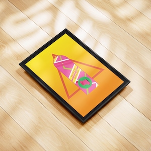 May include: A framed print featuring a stylized hoverboard design from the movie Back to the Future. The artwork has a yellow and orange gradient background with a pink and green hoverboard graphic and the text "HOVER BOARD".