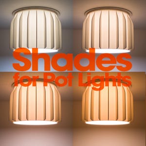 May include: A set of four off-white, pleated, cylindrical light shades designed for pot lights, displayed in a grid with varying warm and cool light temperatures. The text "Shades for Pot Lights" is overlaid in large, bold, orange lettering.