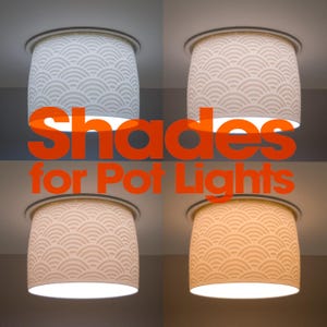 May include: Four cylindrical light shades for pot lights, each featuring a white, embossed, repeating semi-circular wave pattern. The shades are shown illuminated with varying light temperatures, ranging from cool white to warm yellow tones.