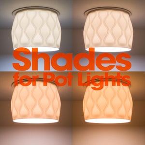 May include: A set of four white cylindrical light shades for pot lights, each featuring a repeating vertical wavy pattern. The shades are shown illuminated with varying light temperatures, ranging from cool white to warm amber tones.