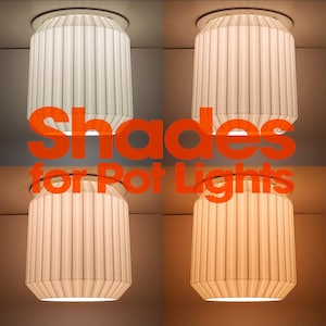 May include: Four white pleated cylindrical light shades for pot lights, each displaying a different color temperature of illumination ranging from cool white to warm yellow, with the orange text Shades for Pot Lights overlaid in the center.