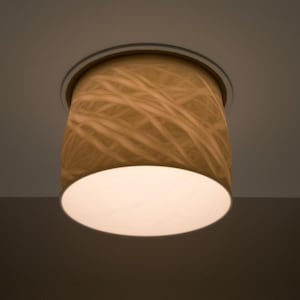 May include: A cylindrical ceiling light fixture with a cream-colored lampshade. The shade has a pattern of light brown, wavy lines. The bottom of the shade is white, and the fixture is mounted on a silver ring.