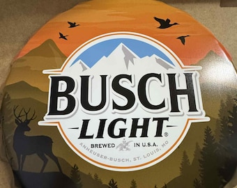 Busch Light 18" Bottle Cap Tin Sign – Vintage Hunting Scene Wall Decor – Deer & Mountain Bar Sign