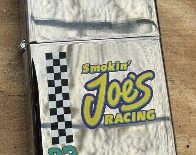 This 1997 Smoking Joe's Racing Zippo lighter is a must-have for any Zippo collector or racing fan.