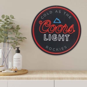 Coors Light &quot;Cold as the Rockies&quot; Round Metal Sign – Fun Man Cave, Bar, or Game Room Decor – 11&quot; – Made in the USA