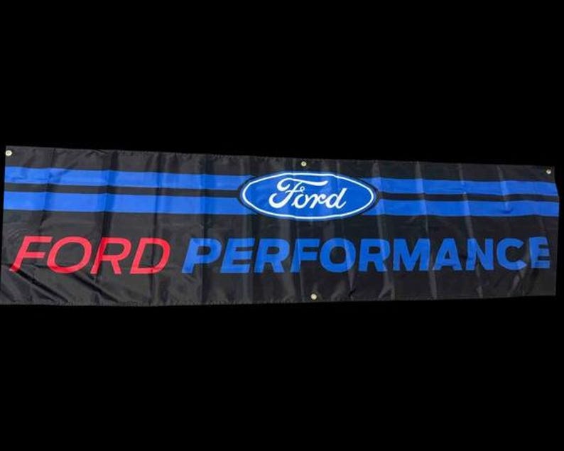 May include: A black banner with blue stripes and the Ford logo in blue and white. The text "FORD PERFORMANCE" is in red letters.