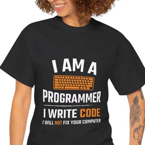 May include: A black t-shirt with white text that reads "I am a programmer I write code I will not fix your computer" and a graphic of an orange computer keyboard.