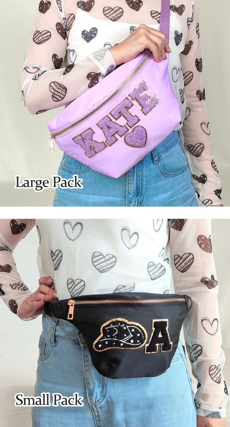 May include: Two fanny packs, one purple with the name "KATE" in gold glitter and one black with a gold glitter cowboy hat and the letter "A". Both fanny packs are worn by a person wearing a white shirt with a brown heart pattern.