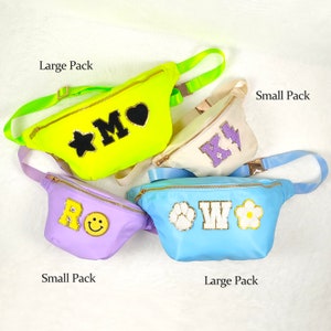 May include: Four fanny packs in different colours and sizes. The packs are decorated with letters, stars, hearts, flowers, and paw prints. The text "Large Pack" and "Small Pack" is written on the image.